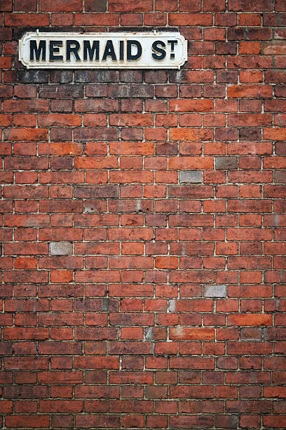 istock brick wall street sign mermaid st rye uk 178453575