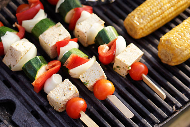 Vegetarian Barbecue,  marinated vegetables and tofu kebabs on a grill