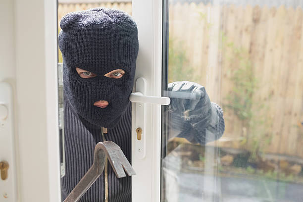 istock Burglar looking if someone is into the room 178453951