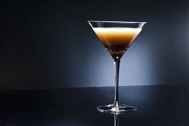 Coffee Martini Coffee Martini cocktail in front of disco lights martini stock pictures, royalty-free photos & images