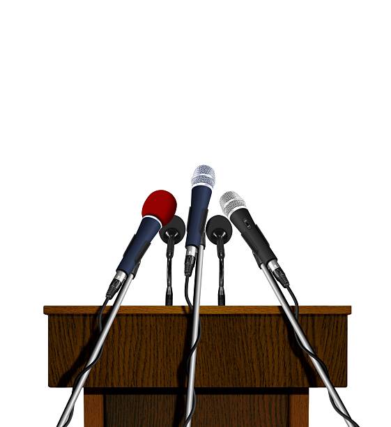 istock Press conference podium and microphones 178455074