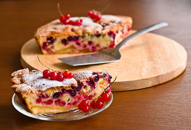 Closeup fresh berries tart on wooden background