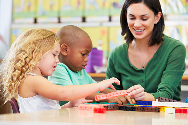 istock Young school children counting in a class room 178456132
