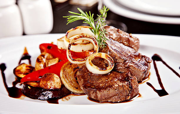 istock Beef steak with vegetables, rosemary and soy sause 178456249
