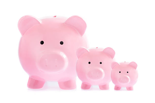 Three pink piggy banks Three pink piggy banks isolated on white background a penny saved stock pictures, royalty-free photos & images