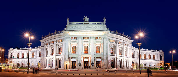 Exterior night view of the majestic Burgtheater in Vienna stock photo