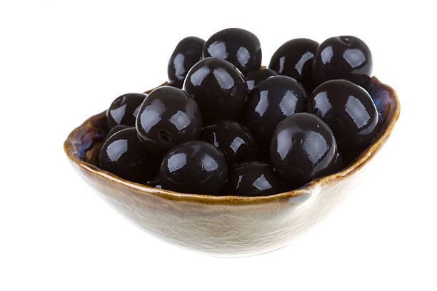 istock Olives black watered with olive oil in bowl isolated 178456818
