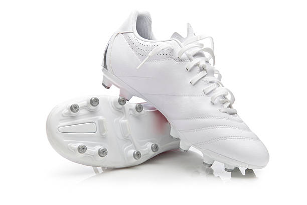 White pair of soccer shoes in white background White soccer sport shoes on white background cleat stock pictures, royalty-free photos & images