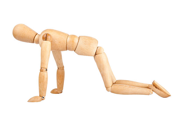 istock Wooden dummy on a knees 178458558