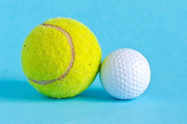 istock golf and tennis balls on azure background 178458875