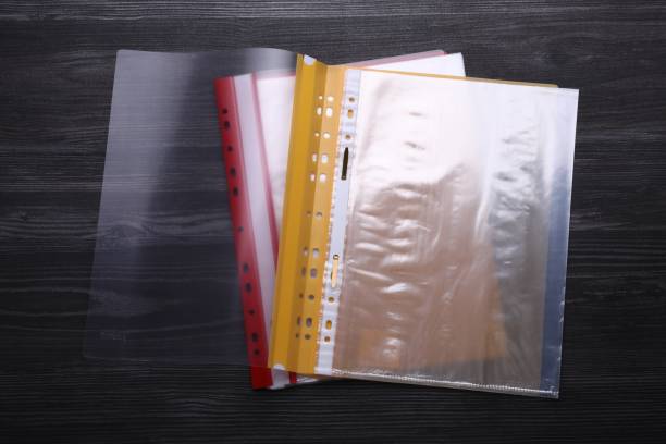 istock File folders with punched pockets on black wooden table, flat lay 1784589619