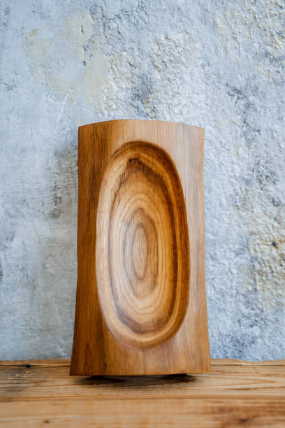 istock Kitchen utensils made of natural materials. On a light background there is a plate of light wood, the plate has an unusual notn. Cutting on wood and from it, creative activities on wood. 1784591746