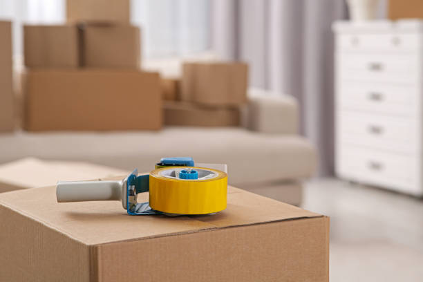 istock Dispenser with roll of adhesive tape on box indoors. Space for text 1784591772