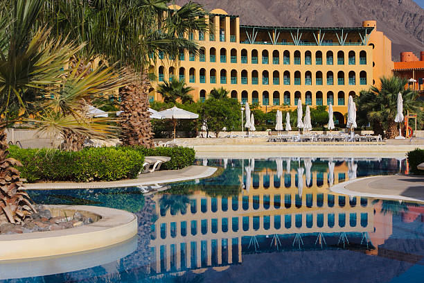 istock Luxury hotel facade with it's reflection in swimming pool 178459400
