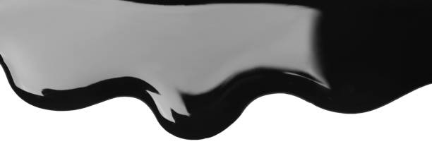 istock Black glossy paint spilled on white background, top view 1784603703