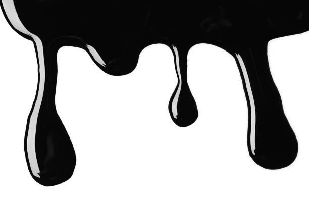 istock Drops of black glossy paint on white background, top view 1784604229