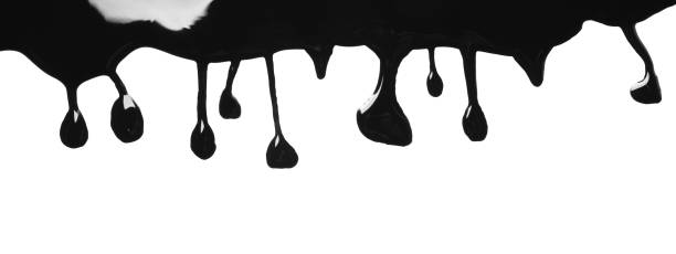 istock Black glossy paint spilled on white background, top view 1784604773