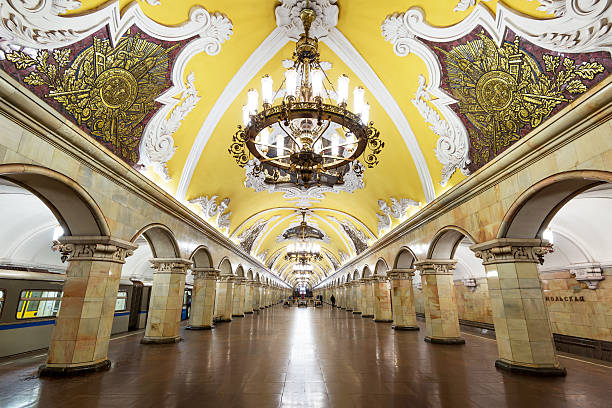 Train at the metro station Komsomolskaya in Moscow, Russia Metro station Komsomolskaya is a great monument of the Soviet era. moscow stock pictures, royalty-free photos & images