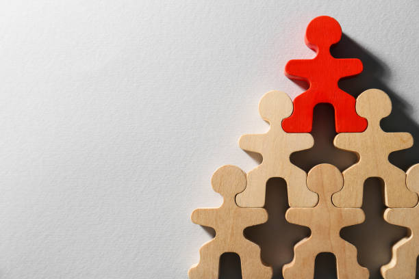 istock Red figure among wooden ones on white background, flat lay with space for text. Recruiter searching employee 1784611148
