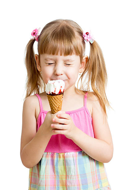 istock kid girl eating ice cream in studio 178461301