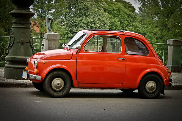 istock Old little red car on the street 178461311