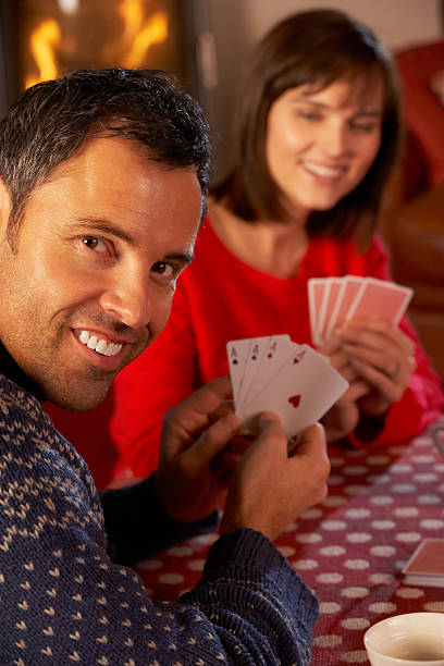 istock Couple Playing Cards By Cosy Log Fire 178461406