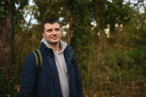 istock hiker in woods and brezze fresh air. 1784614492