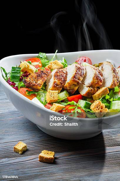 Hot And Fresh Caesar Salad Stock Photo - Download Image Now - Appetizer, Arugula, Black Background