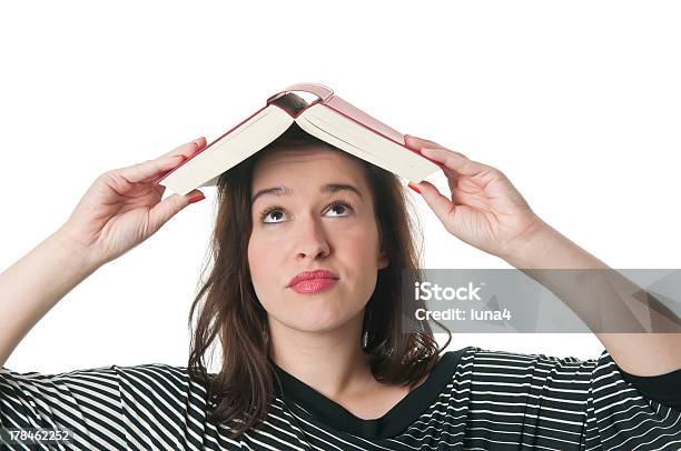 Woman With Book On Head Stock Photo - Download Image Now - Dictionary, Suspicion, Adult