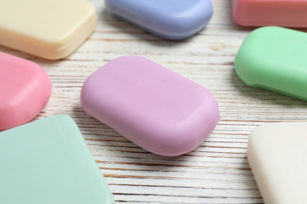 istock Many different soap bars on wooden table, closeup 1784628616