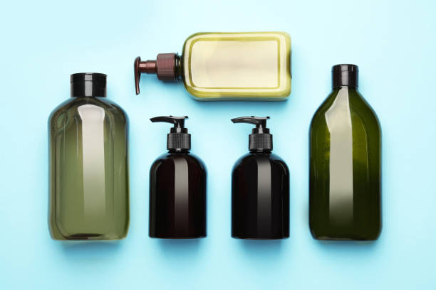 istock Bottles of shampoo on light blue background, flat lay 1784629659