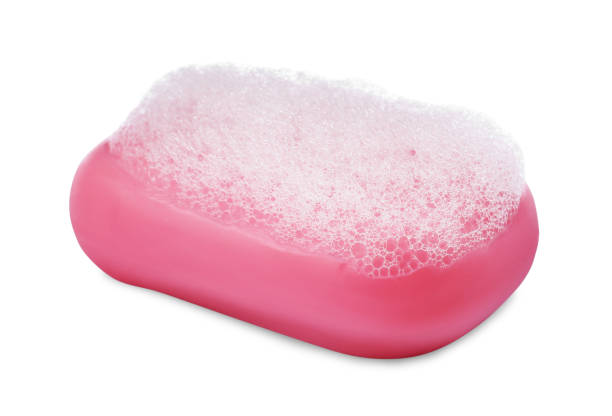 istock Soap bar with fluffy foam on white background 1784631086