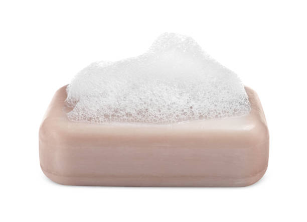 istock Soap bar with fluffy foam on white background 1784632387