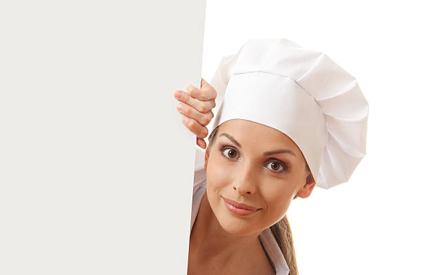 istock Woman chef, baker or cook holding white paper sign 178463313