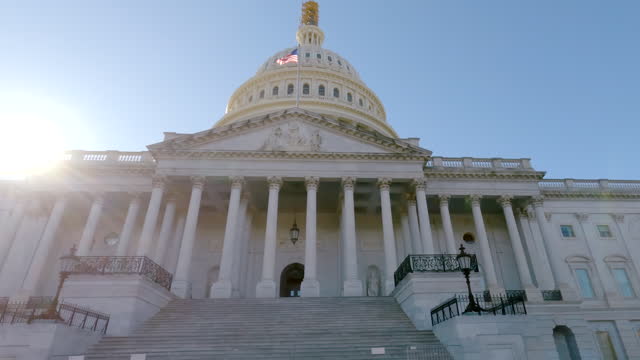 United States Capitol Building East Facade with American Flag in Washington, DC