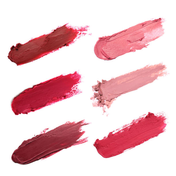 istock Smears of different beautiful lipsticks on white background, top view 1784637758