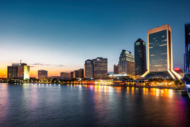 Waterfront of Downtown Jacksonville Florida USA and the St Johns River at night.