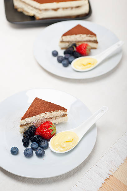 istock tiramisu dessert with berries and cream 178464667