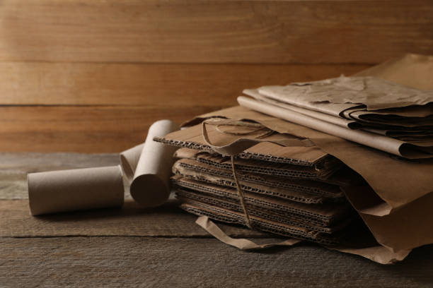 istock Different waste paper on wooden table, closeup 1784647092