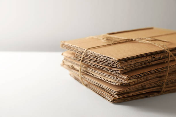 istock Stack of waste paper on beige background, closeup. Space or text 1784647122