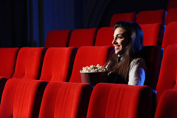istock young woman sitting in an empty theater 178464727