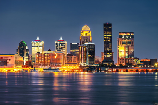 Skyline of Louisville Kentucky USA and the Ohio River at night