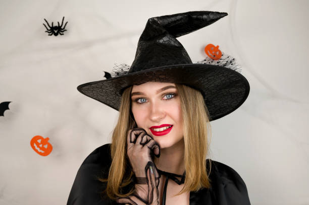 istock Halloween background with woman dressed as witch.Costume party concept 1784656892