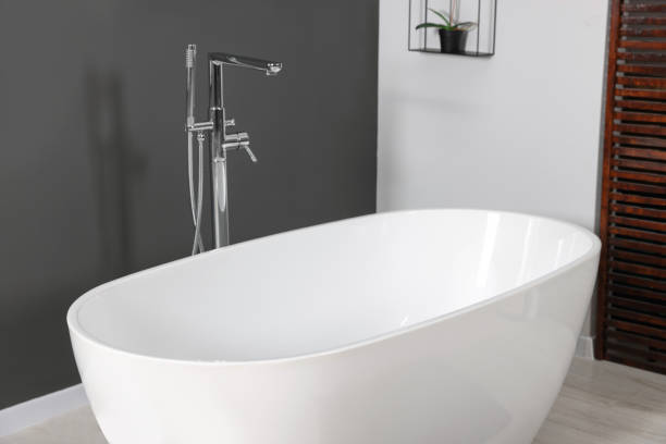 istock Stylish ceramic tub and modern tab in bathroom 1784657398