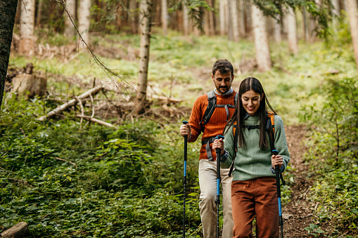 Couple with backpacks and hiking poles
