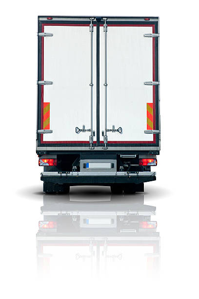 The back of a truck trailer on a white reflective background