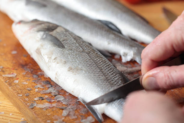 istock Cleaning a sea bass 178466516