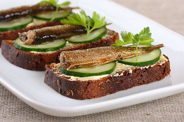 istock toast with sprats on a white plate 178466584