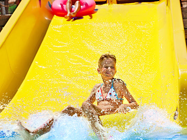 istock Child on water slide at aquapark. 178467994