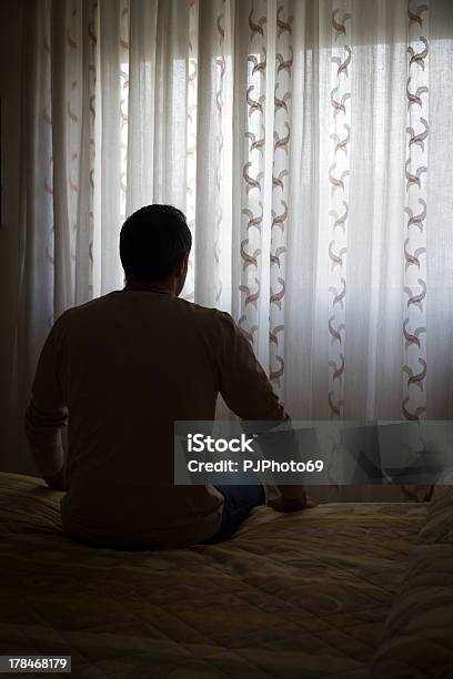 Depressed Single Man Sitting On Bed Stock Photo - Download Image Now - Addiction, Adult, Adults Only